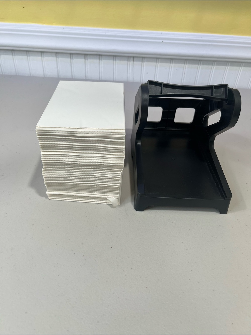 Black label Dispenser with Stack of White thermal labels